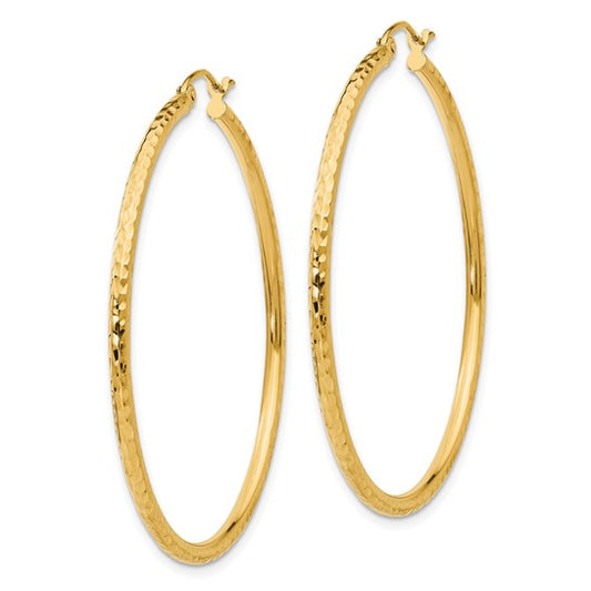 Gold hoop earrings on a white background
Material: 10K yellow gold
Color: yellow gold
Closure: Wire and Clutch
Measurement: 45 mm width, 45 mm length, 2 mm thickness
Style: 10TC237