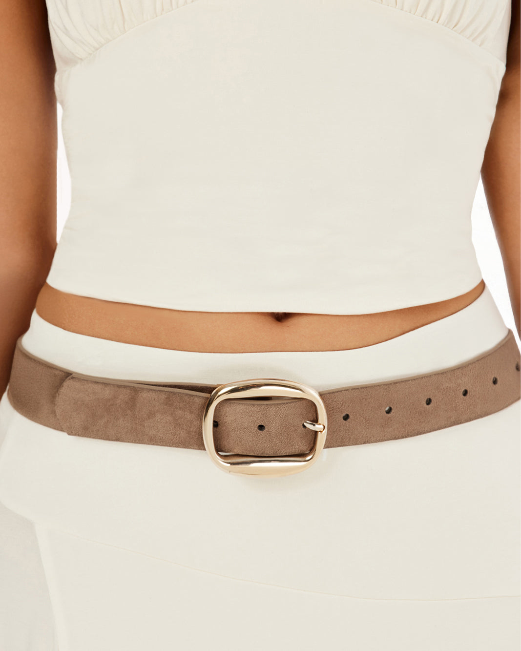 Brown belt with a gold buckle worn by a person on a white background