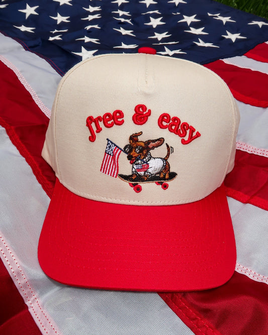 Cap with 'free & easy' text and dog illustration on an American flag background