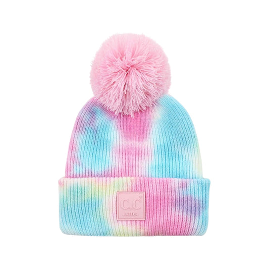 Tie-dye beanie with pink pom-pom and pink logo patch on a white background