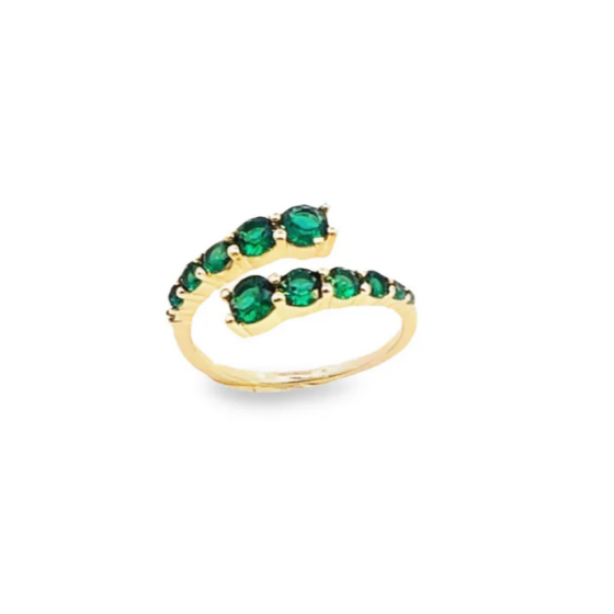 Gold ring with green gemstones on a white background