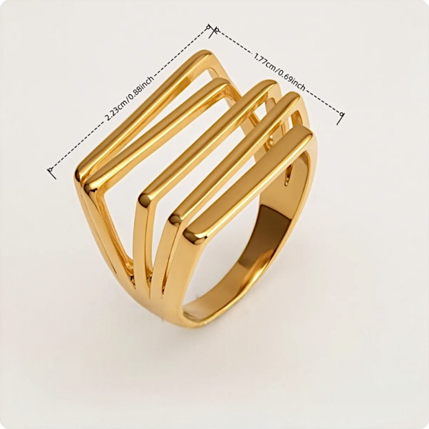 Gold ring with geometric design and measurements on a white background