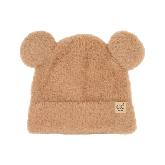 Beige fuzzy hat with ear designs on a white background
