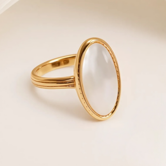 gold with oval white design ring