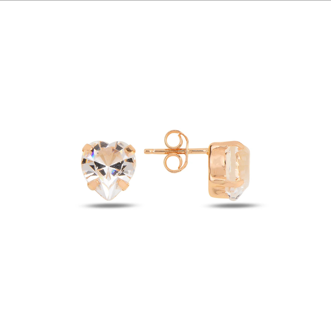 Heart-shaped crystal earrings with rose gold posts on a white background