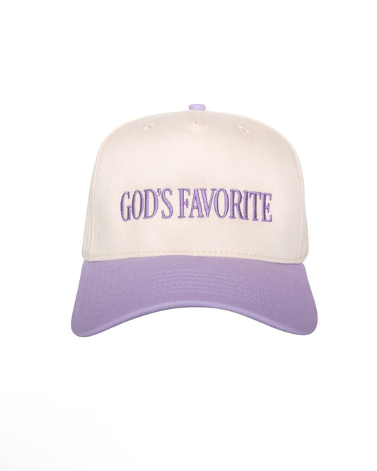 A baseball cap with an off-white crown and a lavender-purple brim, featuring the phrase 'GOD'S FAVORITE' embroidered in purple across the front.
