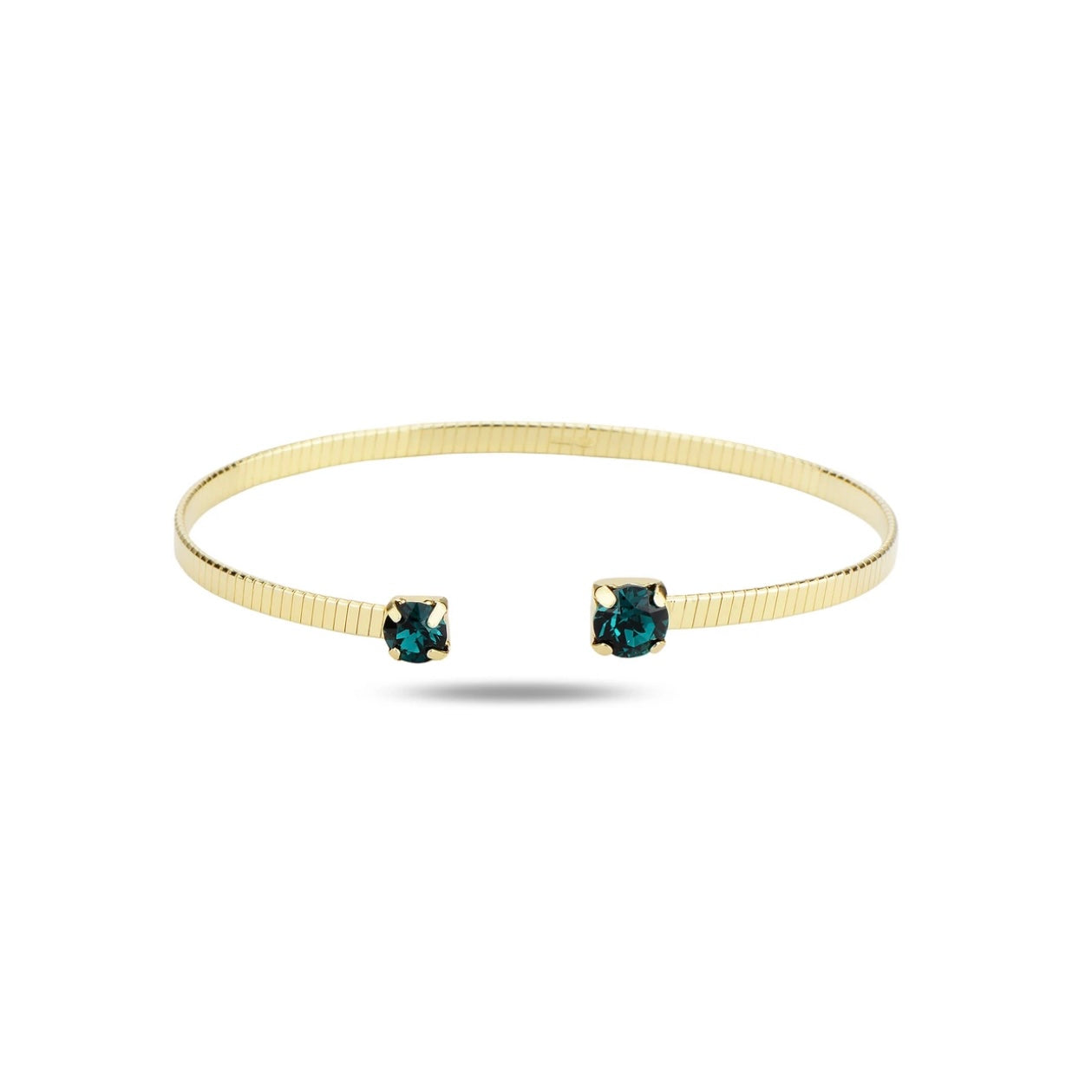 Gold bracelet with green crystals on a white background
Material: 925 sterling silver, gold plated, green Swarovski crystals
Color: gold, dep green
Measurement: 6" length, 3 mm wide
Closure: open, disconnected