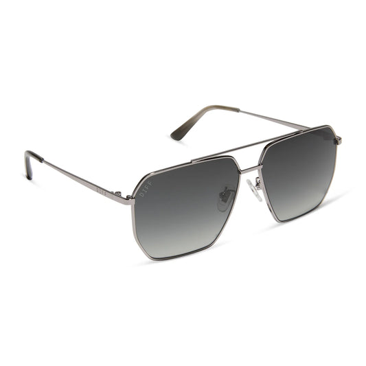 Sunglasses with metallic frame and gradient lenses on a white background