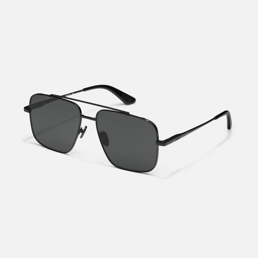 Black sunglasses with dark lenses on a white background