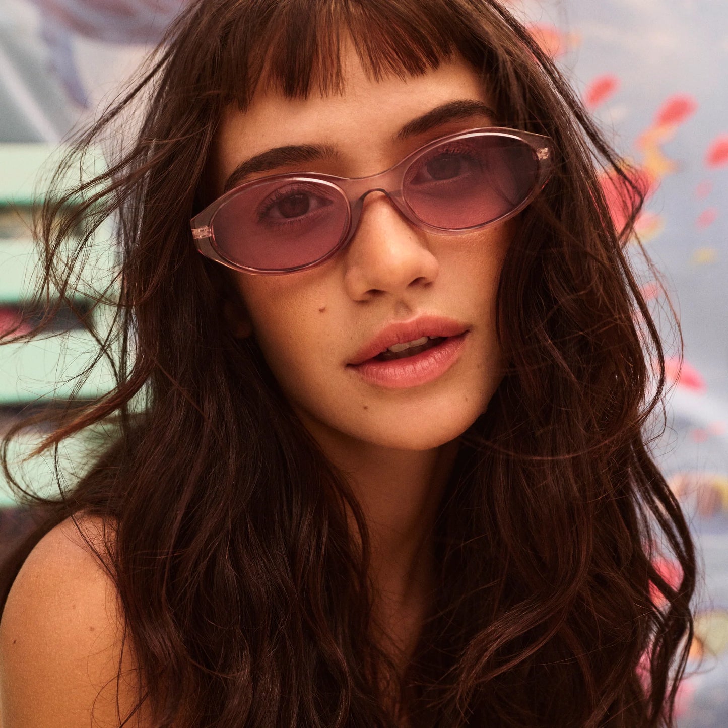 woman wearing the Quay Aura Points Peony sunglasses close up
