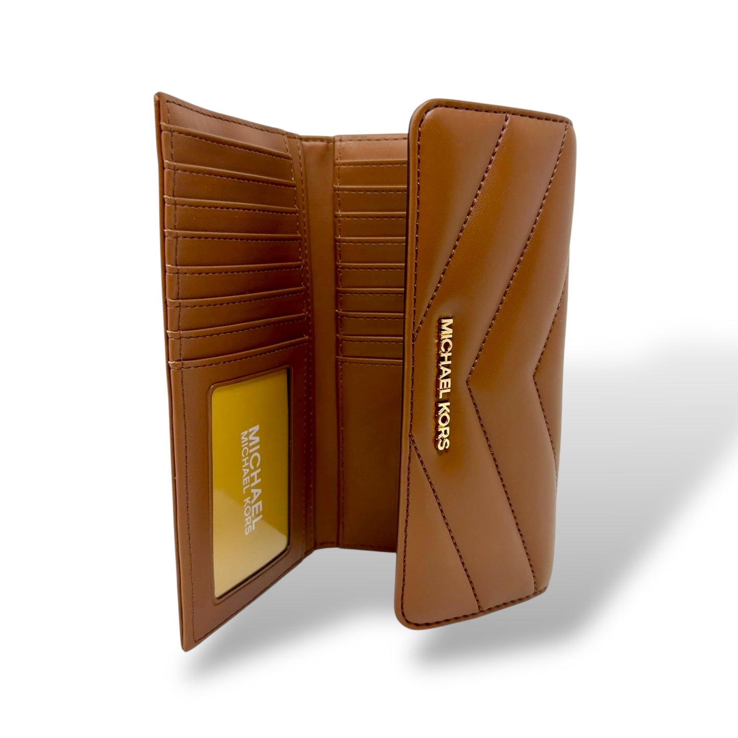 Michael Kors Cognac colored trifold wallet with gold toned logo. Picture features a picture of the open wallet where you can see the interior card slots.
