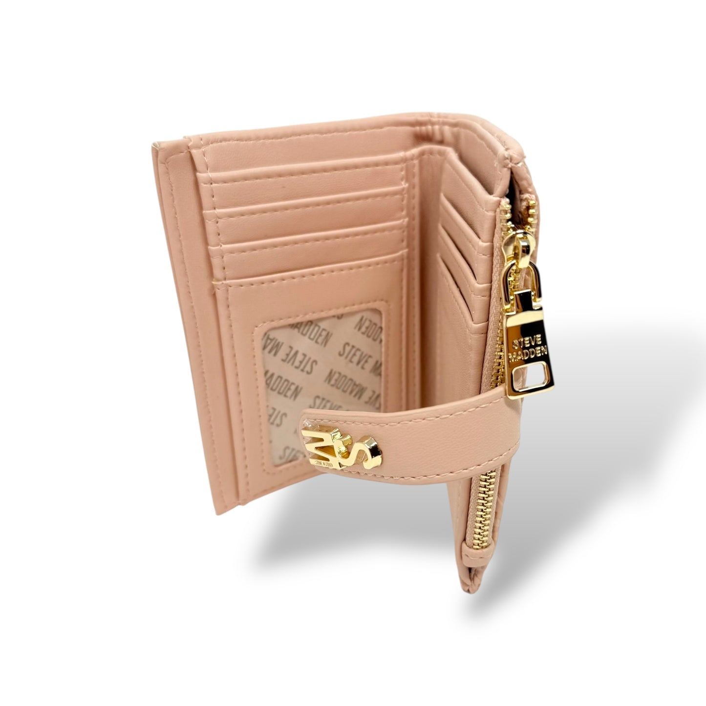 Steve Madden women's light pink wallet with removable card holder. Picture showing inside view of the wallet. You can see the ID window slot, 6 card slots, 2 bill compartments, the snap strap with gold toned logo, and the gold toned zipper for coin pouch
