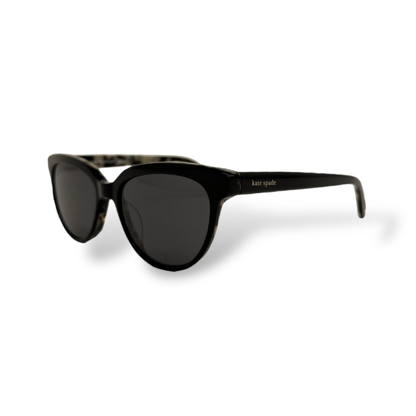 Black sunglasses with a white background
Kate Spade - Cayenne
Frame style: cat-eye light weight
Frame Color: all black outer frame with a black and brown tortoise shell design inside
Lens Color: black gradient
lens technology: 100% UVA/B sun protection