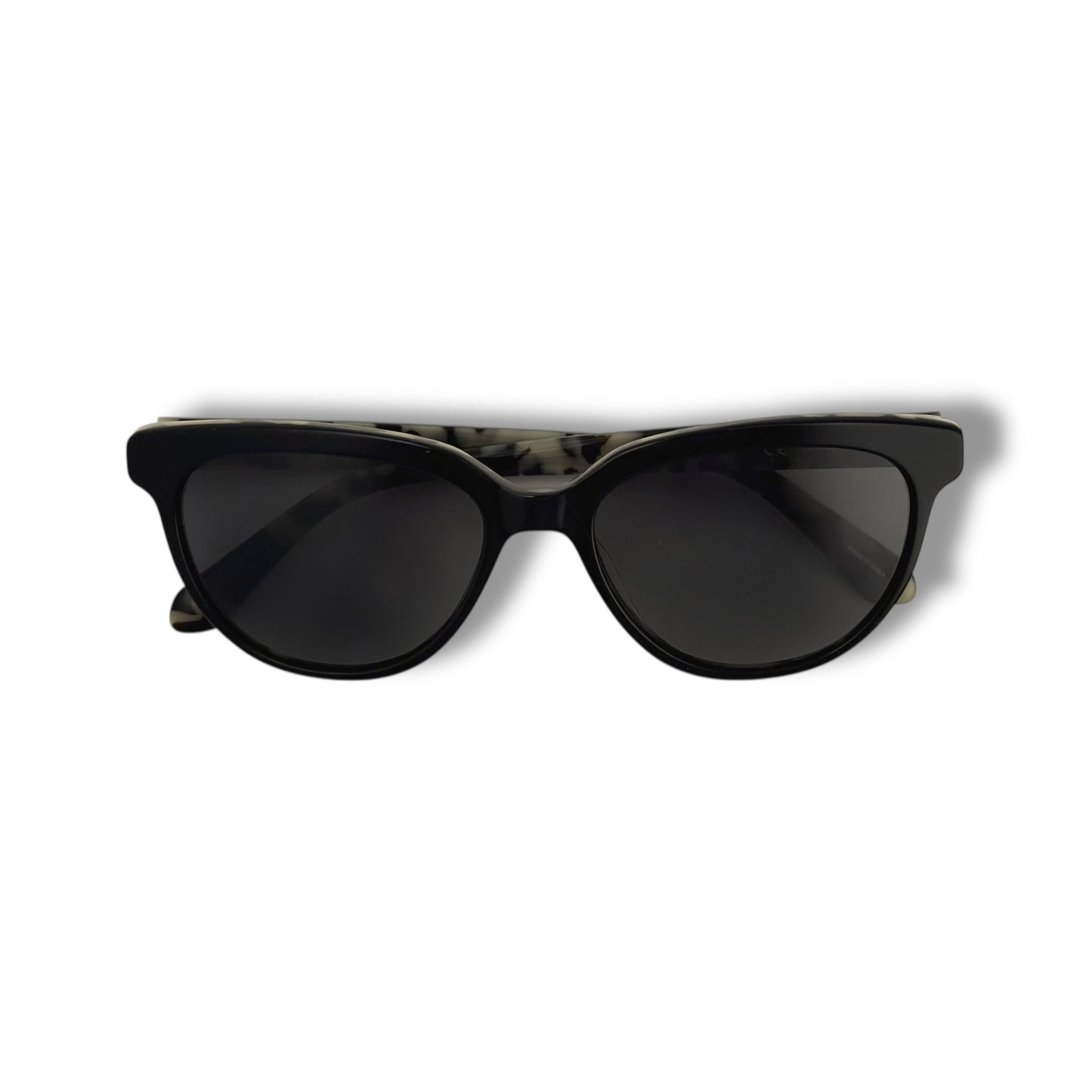 Black folded sunglasses on a white background
Kate Spade - Cayenne
Frame style: cat-eye light weight
Frame Color: all black outer frame with a black and brown tortoise shell design inside
Lens Color: black gradient
lens technology: 100% UVA/B sun protection