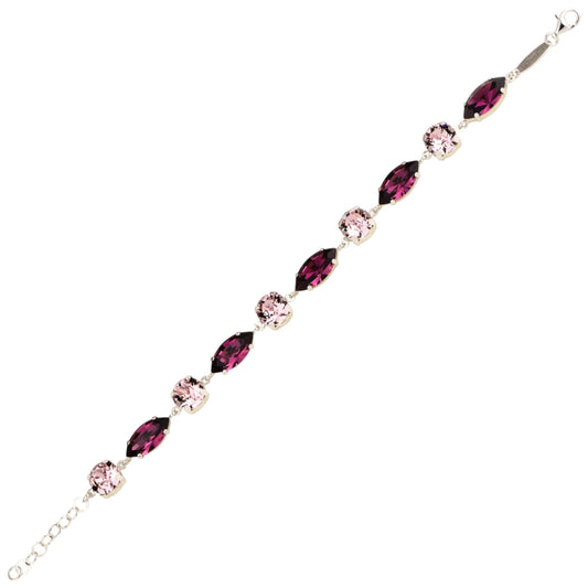 Jewelry bracelet with pink and red gemstones on a white background
Material: 925 sterling silver, Rhodium plated, purple and light rose Swarovski crystals
Color: silver, purple, and light rose
Measurement: 6" length, 1" extension, 6 mm wide 