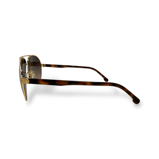 Sunglasses with tortoiseshell frame and gold accents on a white background
Carrera - 1051/S 0Y3R HA
Frame style: Aviator, lightweight
Frame Color: gold wire frame with brown tortoise shell arms
Lens Color: brown gradient