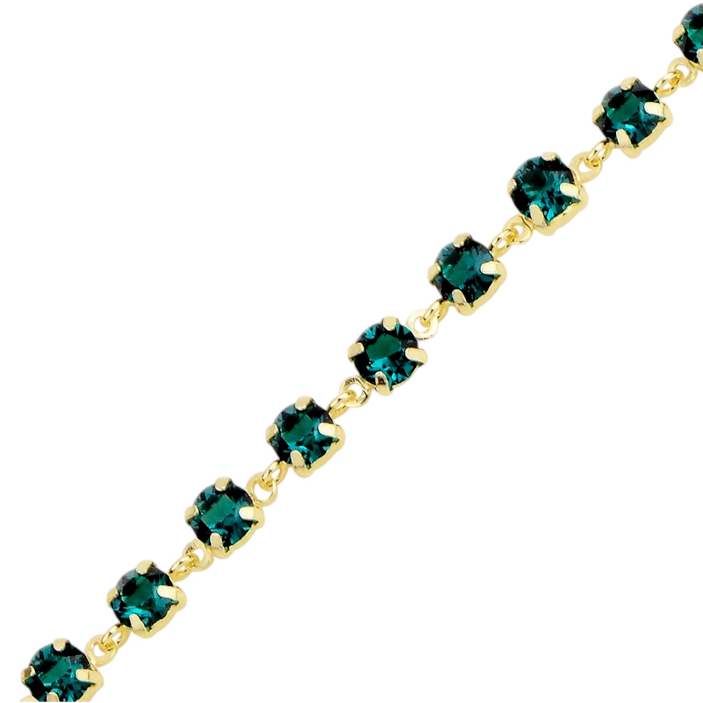 Gold bracelet with green swarovski crystals on a white background