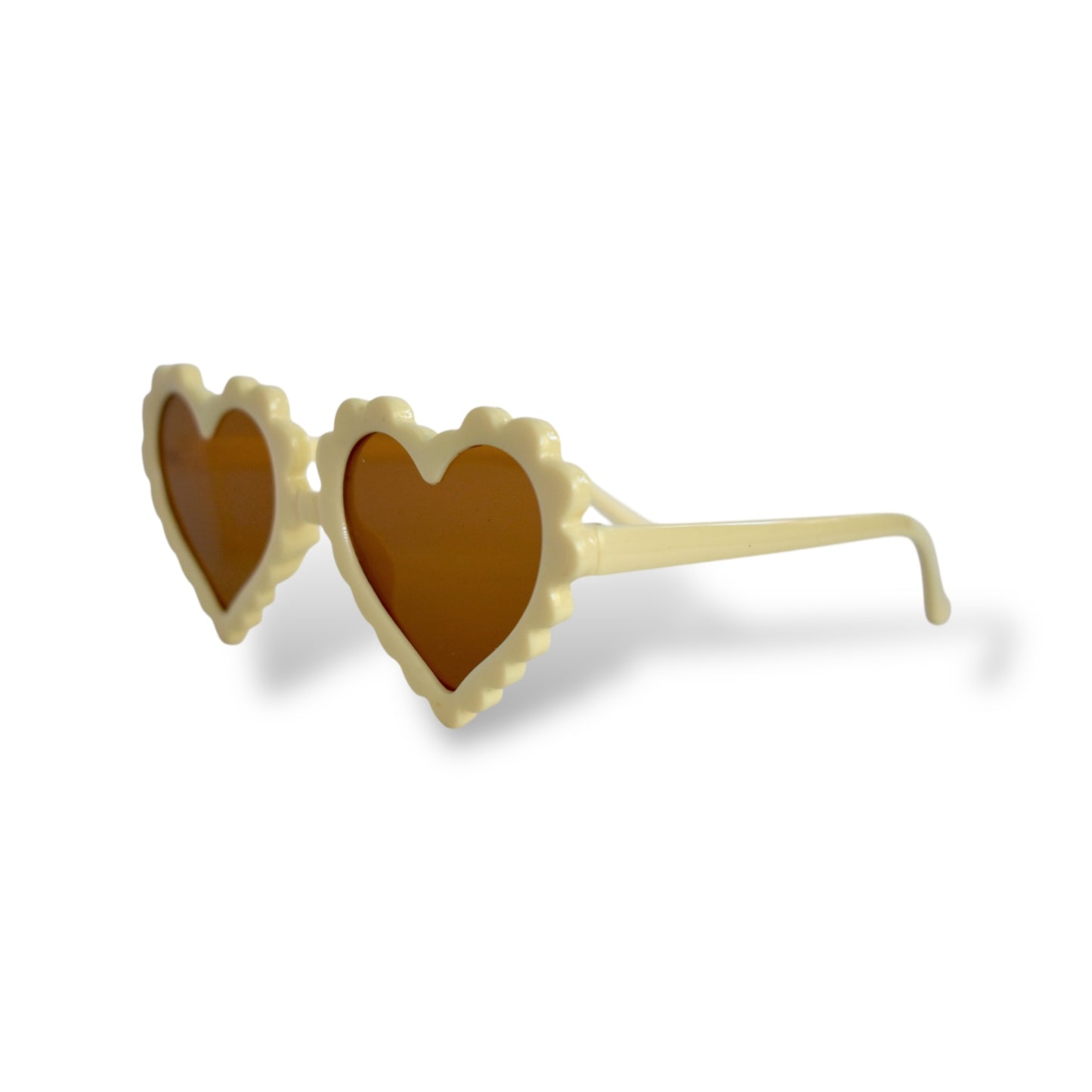 Heart-shaped sunglasses with beige frame and brown lenses on a white background