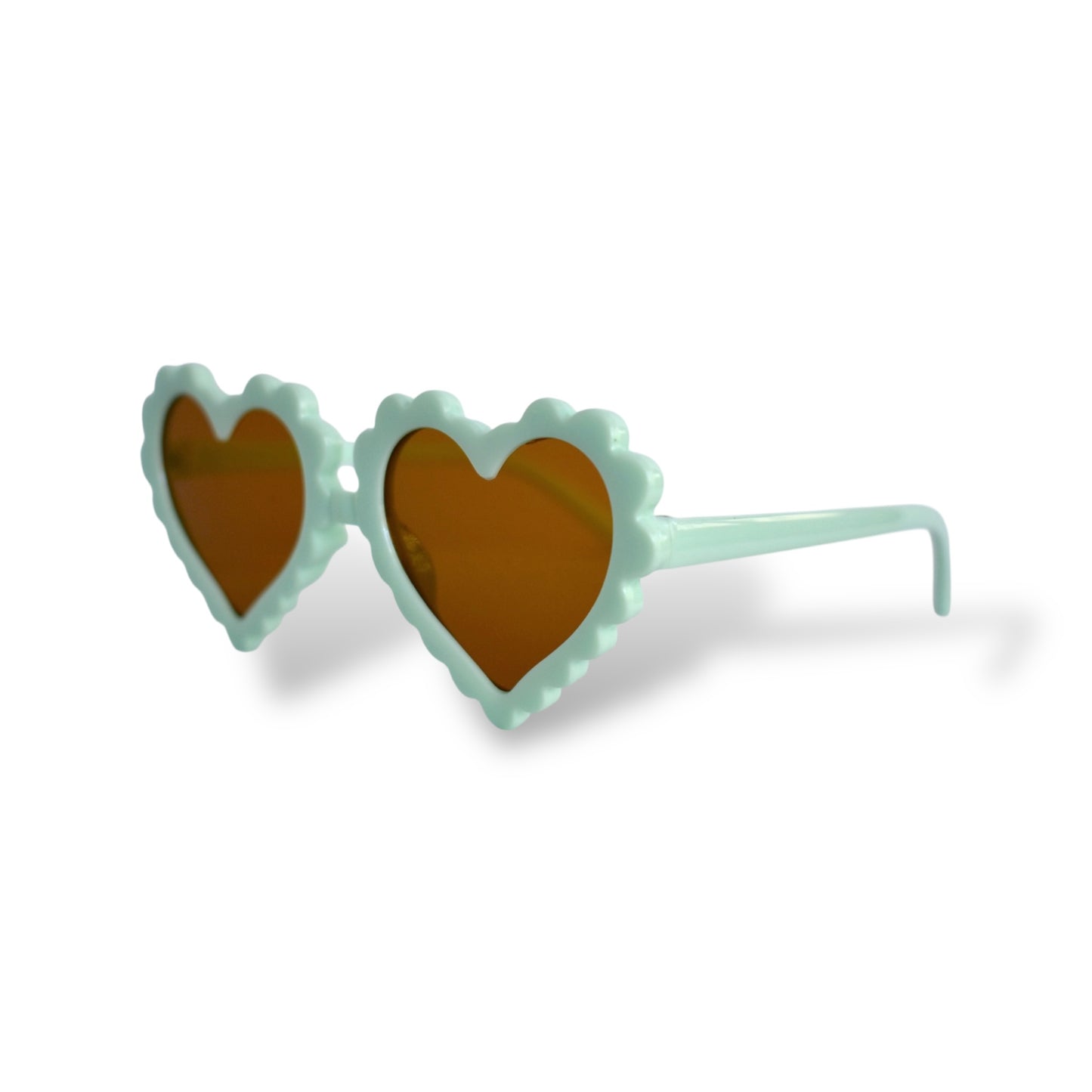 Sunglasses with heart-shaped lenses on a white background