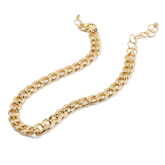 Gold chain necklace on a white background