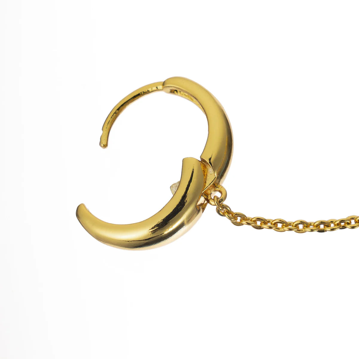 Gold hoop earring with a chain on a white background