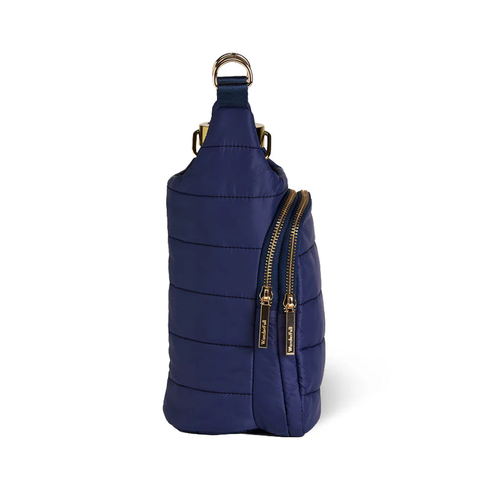 Navy blue sling bag with gold zippers on a white background