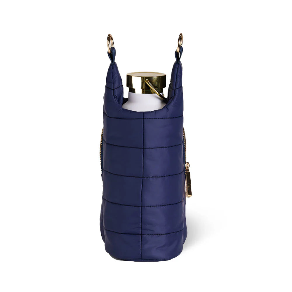 Navy quilted wine bag with gold zippers on a white background