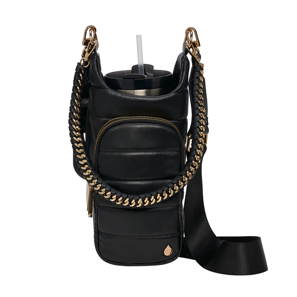 Black leather crossbody bag with gold chain detail on a white background