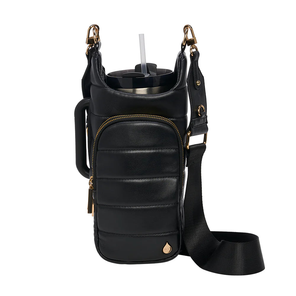 Black leather crossbody bag with a cup holder on a white background