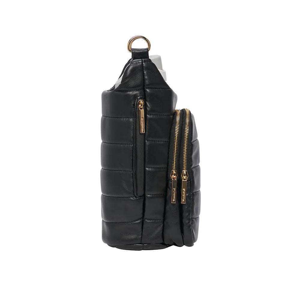 Black quilted crossbody bag with gold zippers on a white background