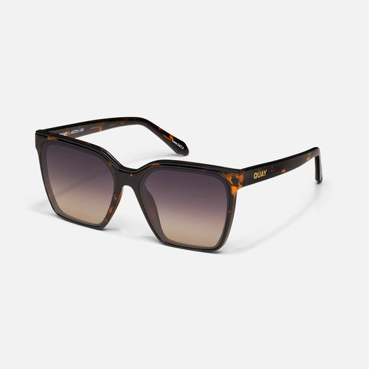 Sunglasses with tortoiseshell frame and gradient lenses on a white background