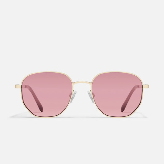 Sunglasses with pink lenses and gold frames on a white background