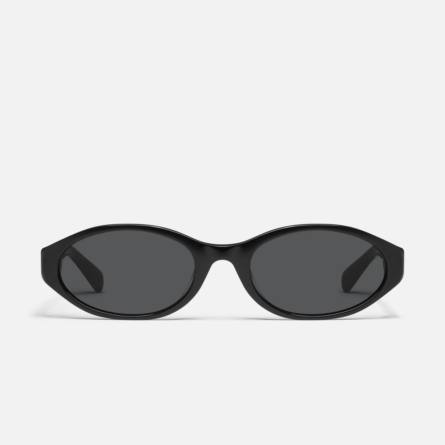 Black sunglasses with dark lenses on a white background