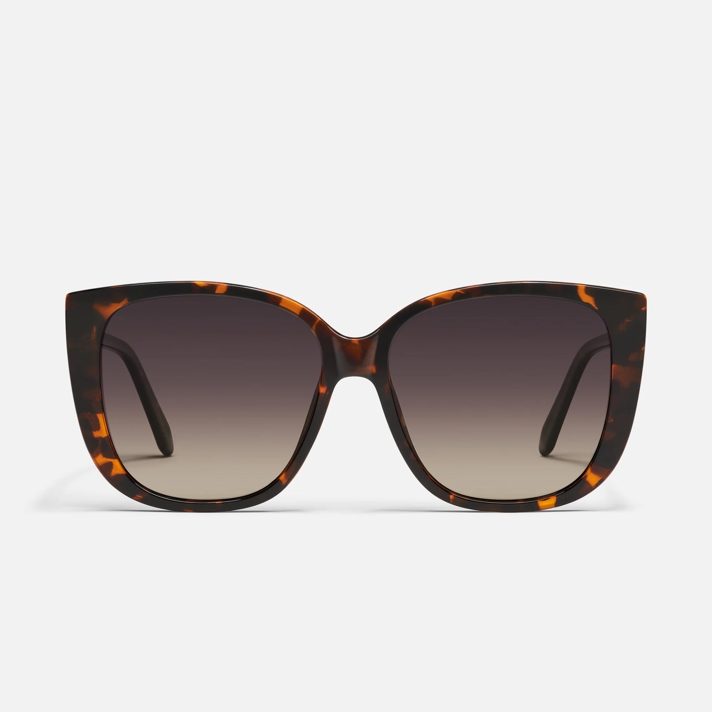 Sunglasses with tortoiseshell frame and gradient lenses on a white background