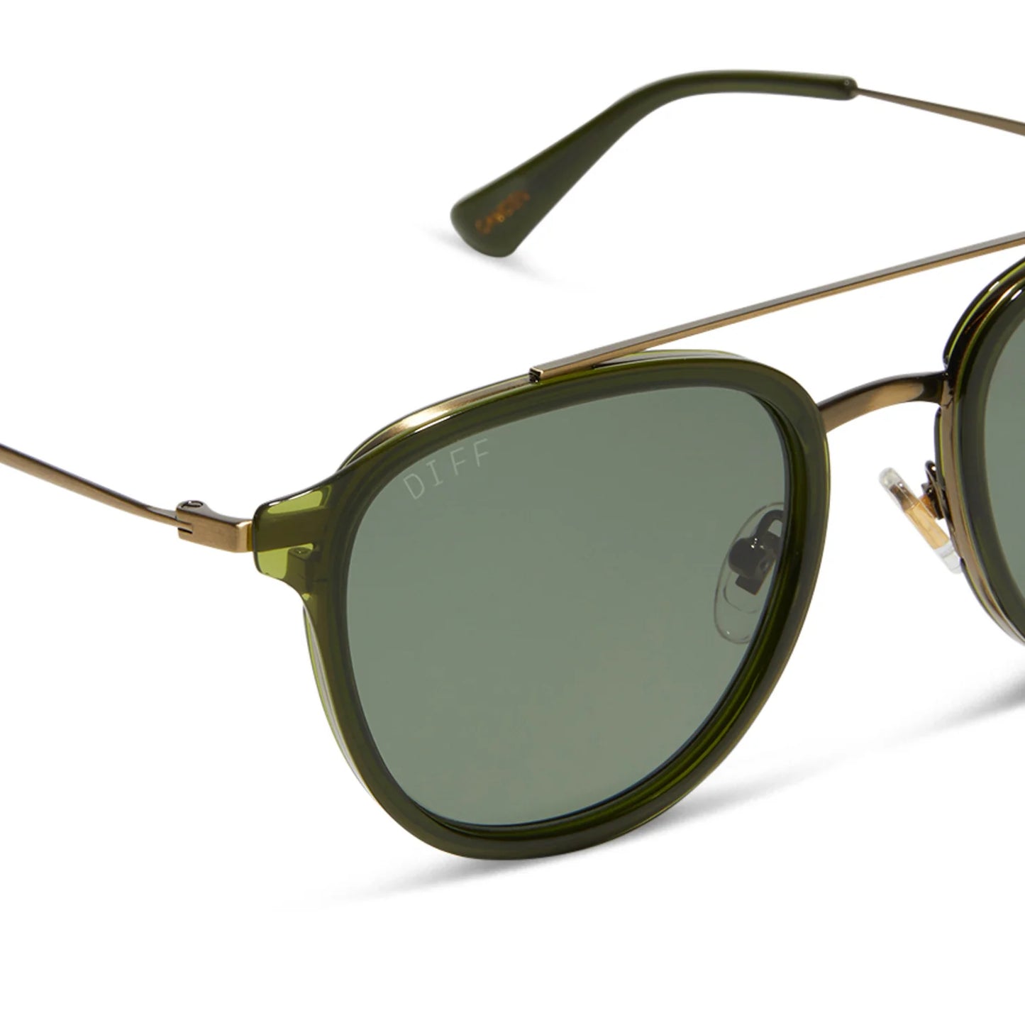 Green sunglasses with gold frames on a white background