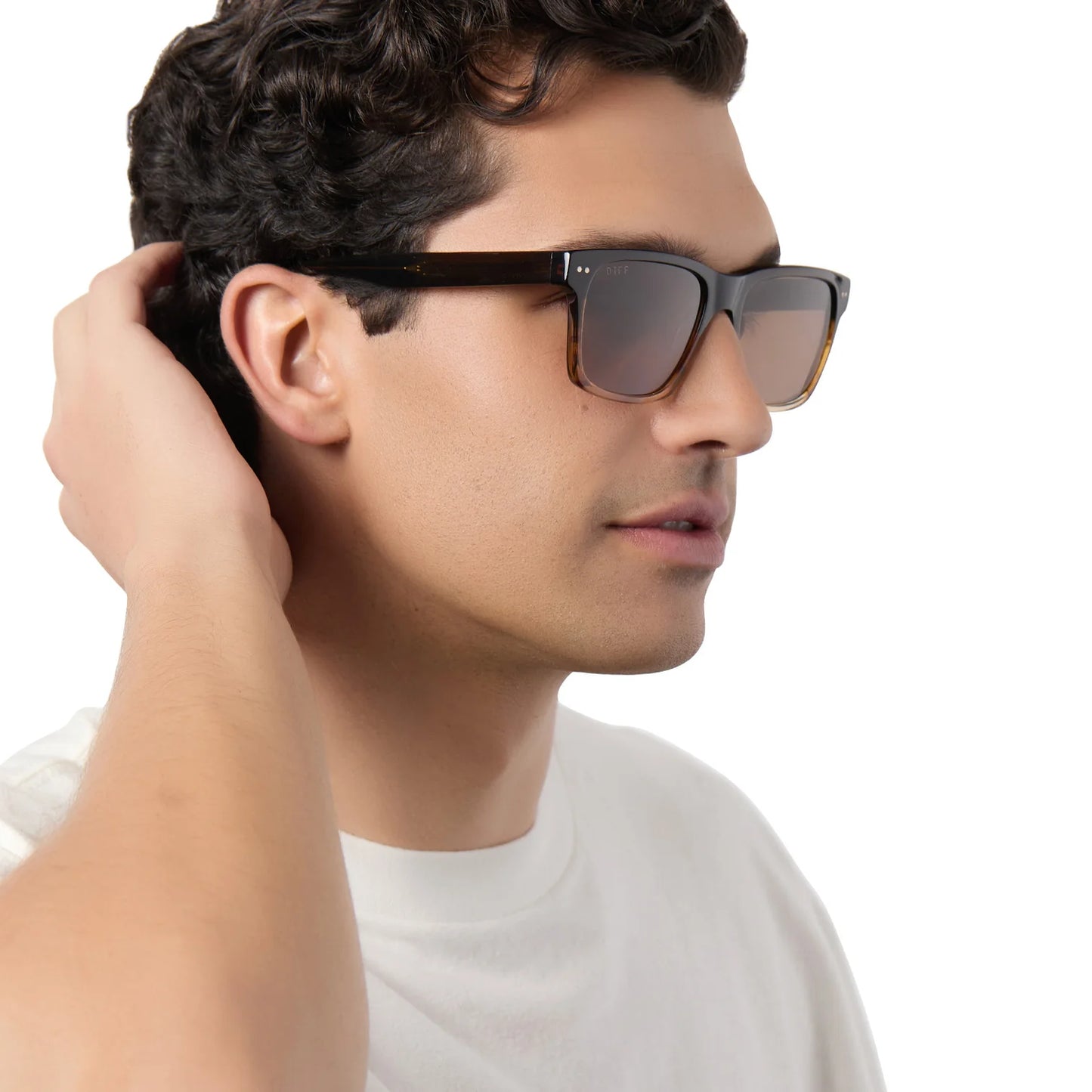 Man wearing sunglasses with a neutral background