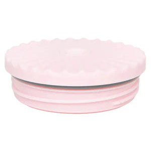 Pink ceramic bowl with ribbed texture on a white background