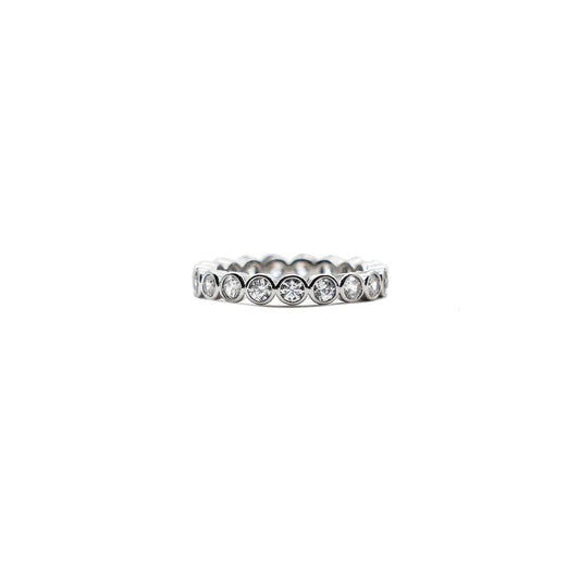 Silver ring with small diamonds on a white background
