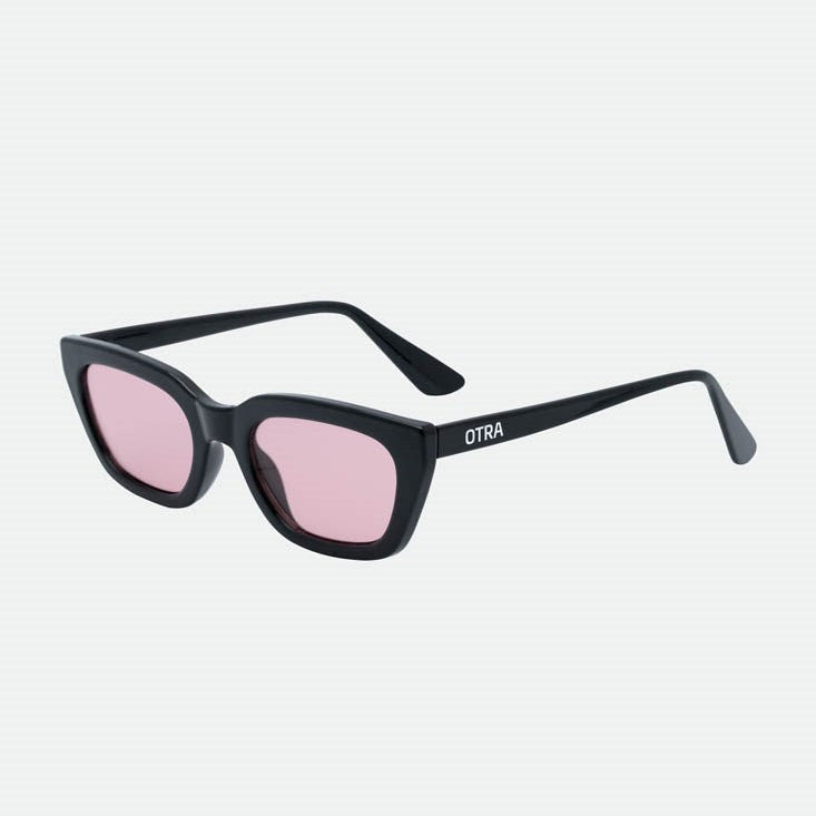 Black sunglasses with pink lenses on a white background