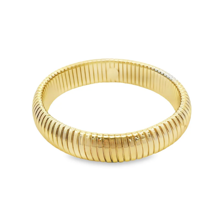 Gold bangle on a white background