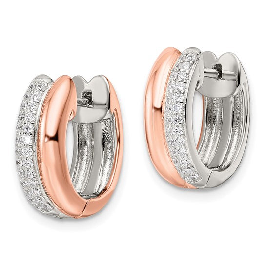 Pair of rose gold and silver hoop earrings on a white background
Material: sterling silver, rose-toned (Flash Plating), pave CZ
Color: silver and rose-gold
Closure: Post, Notch, Lock
Measurement: 6.05 mm thickness, 16.5 mm length, 15.2 mm width