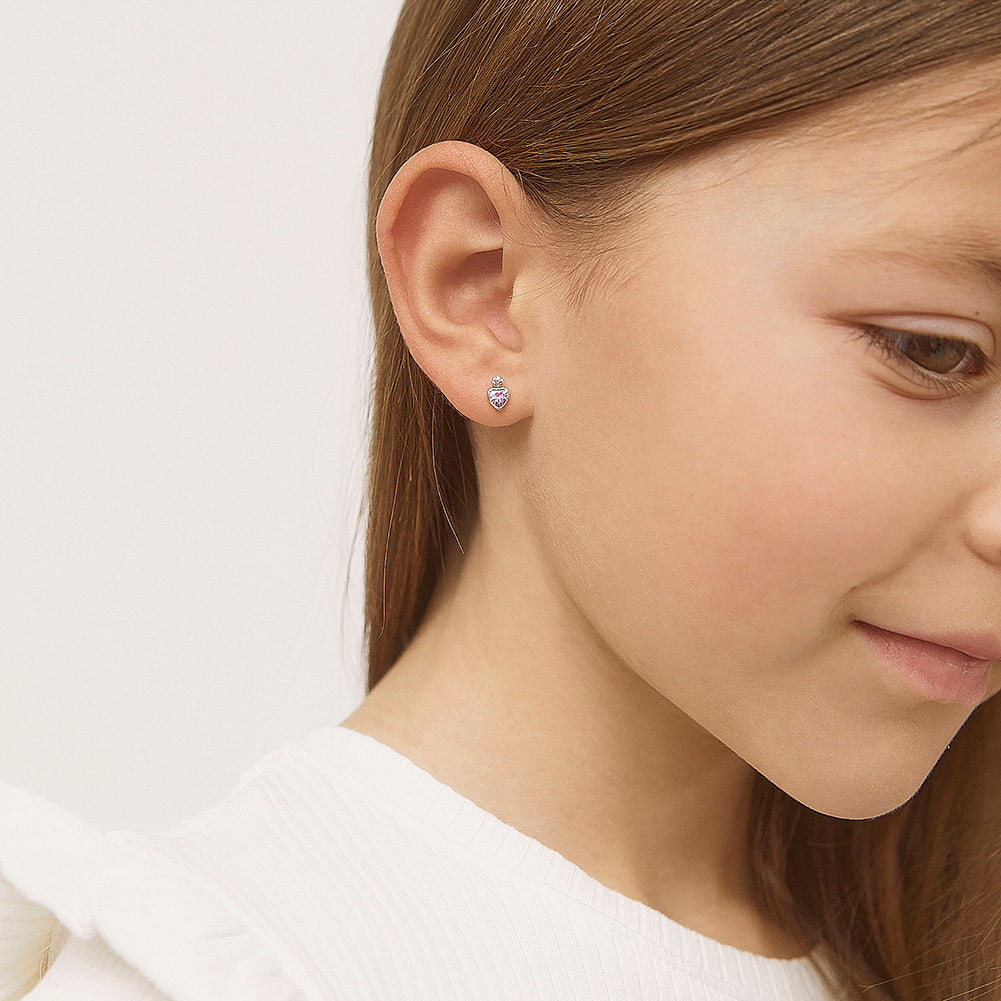 Age Group: Adorable for Infants, Toddlers & Little Girls; Safe for Sensitive Skin
Material: 14k Yellow Gold
Earring Size: 5mm W x 6mm H (pink) heart, (clear) round cubic zirconia; 8mm threaded post
Main Stone: Clear & Pink Cubic Zirconia
Metal Stamp: 14k
picture of young girl wearing the gold and pink heart earrings