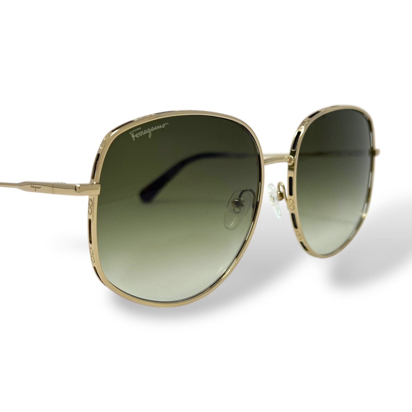 Ferragamo - SF277S Sunglasses women, oversized, lightweight, round wire gold frame with green gradient lens. front, corner view close up of logo on lens