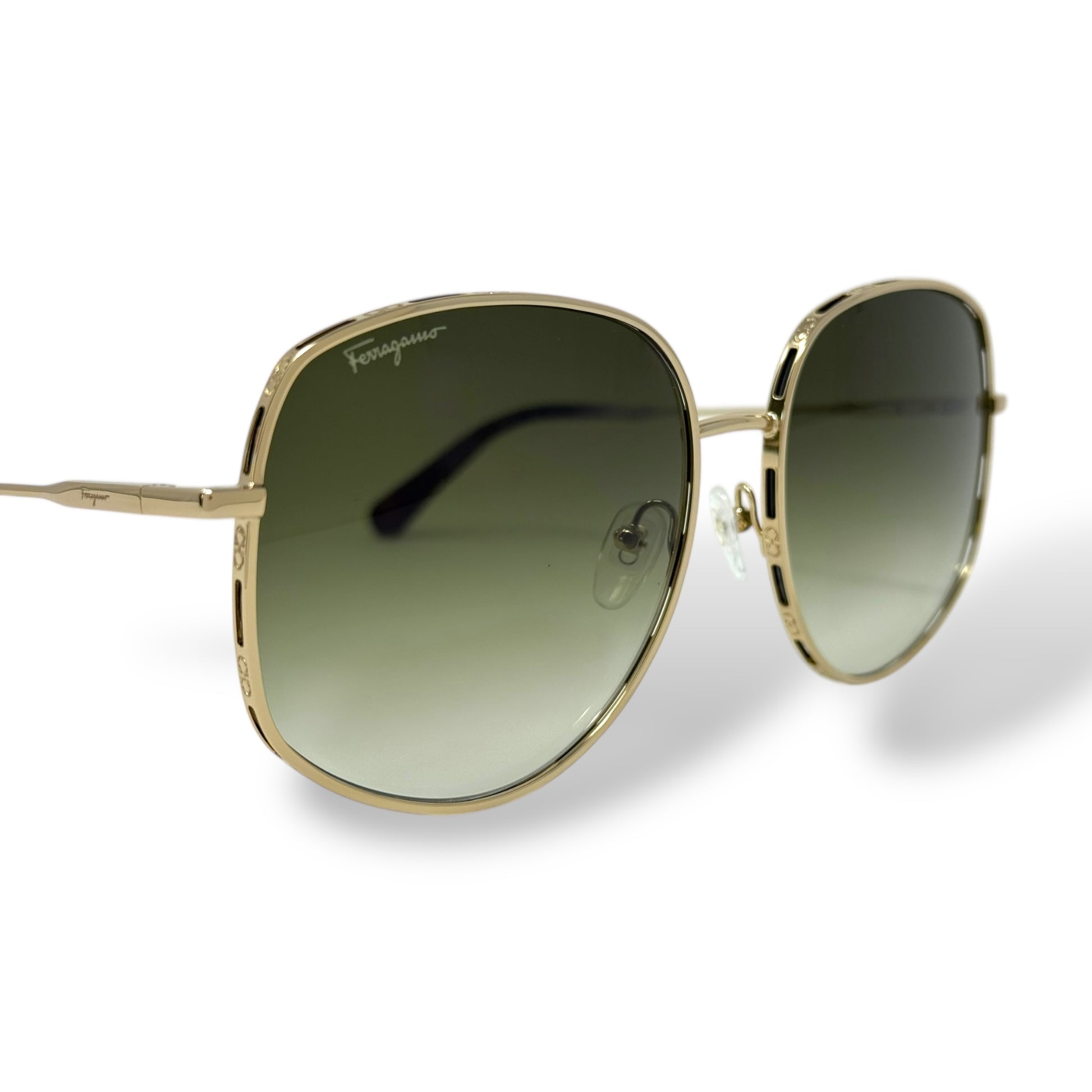 Ferragamo - SF277S Sunglasses women, oversized, lightweight, round wire gold frame with green gradient lens. front, corner view close up of logo on lens