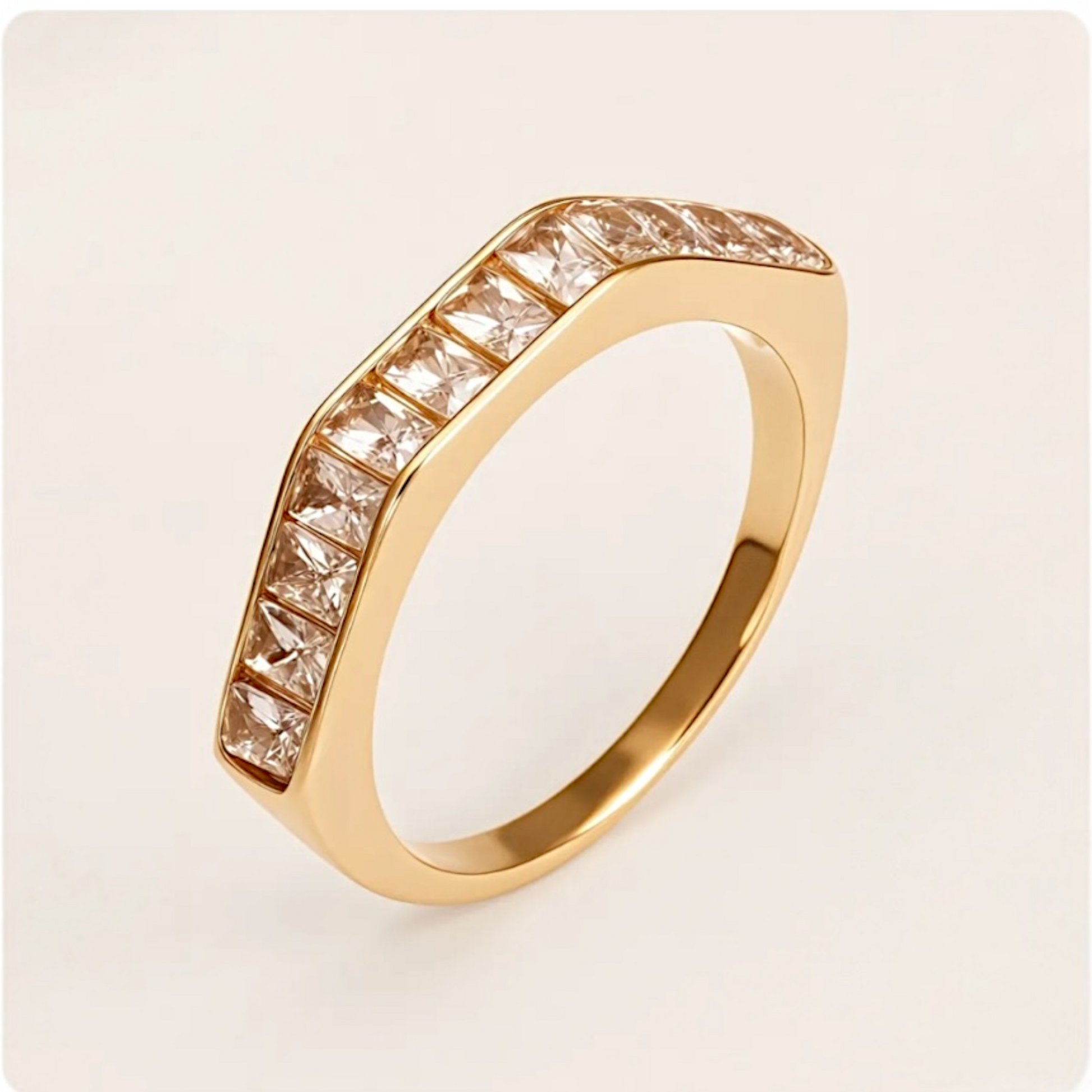 Gold ring with diamond accents on a light beige background