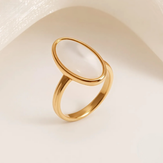 gold oval ring with white center ring