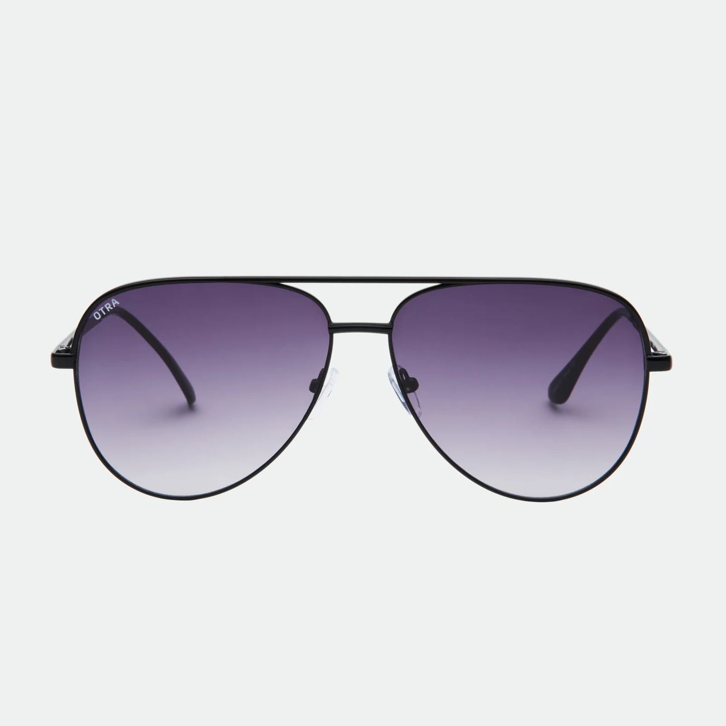 Aviator sunglasses with gradient purple lenses on a white background