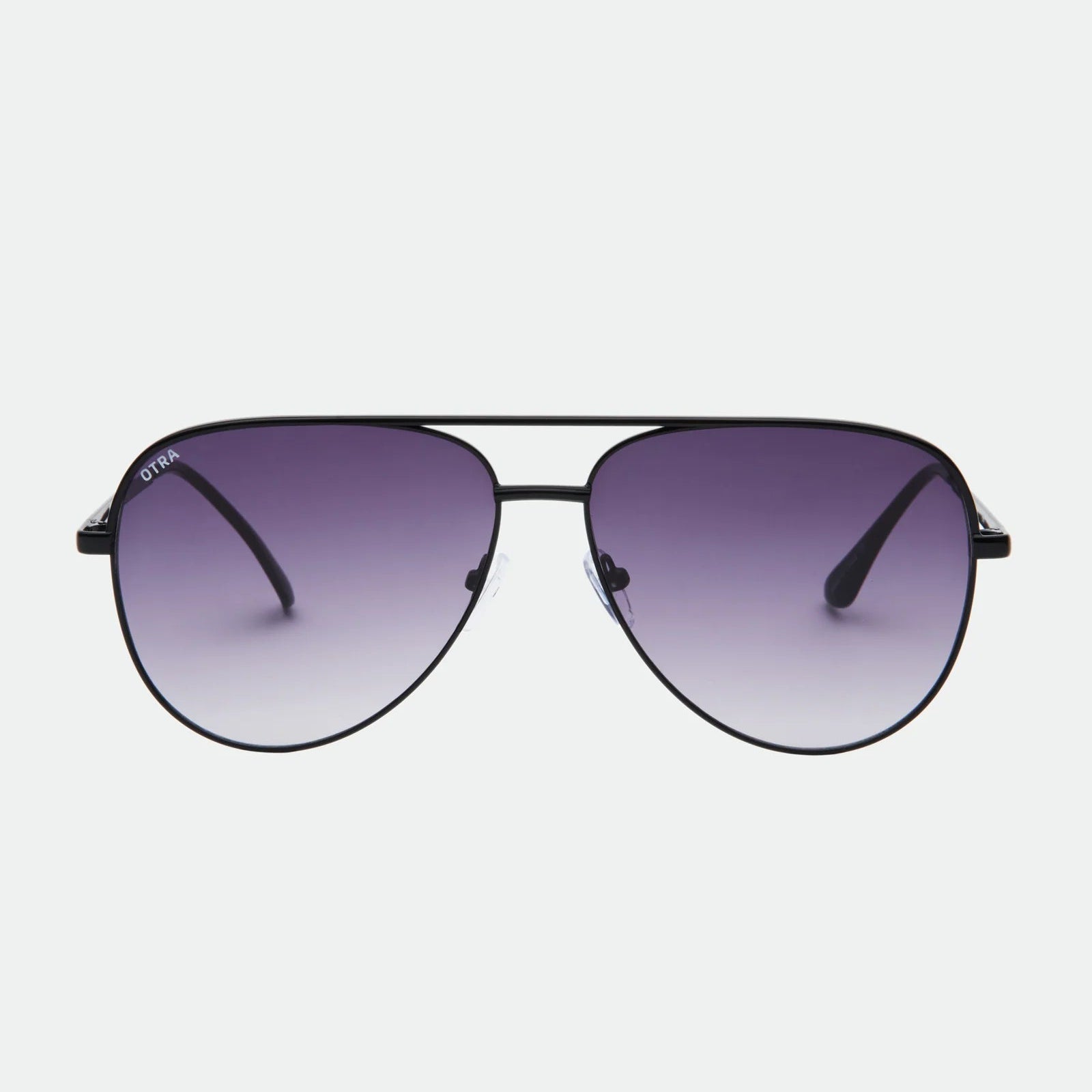 Aviator sunglasses with gradient purple lenses on a white background