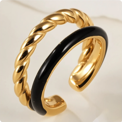 Gold and black ring on a white background