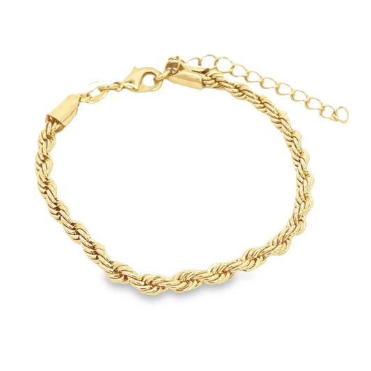Gold braided bracelet on a white background